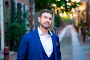 man in blue blazer on a historic Philadelphia street
