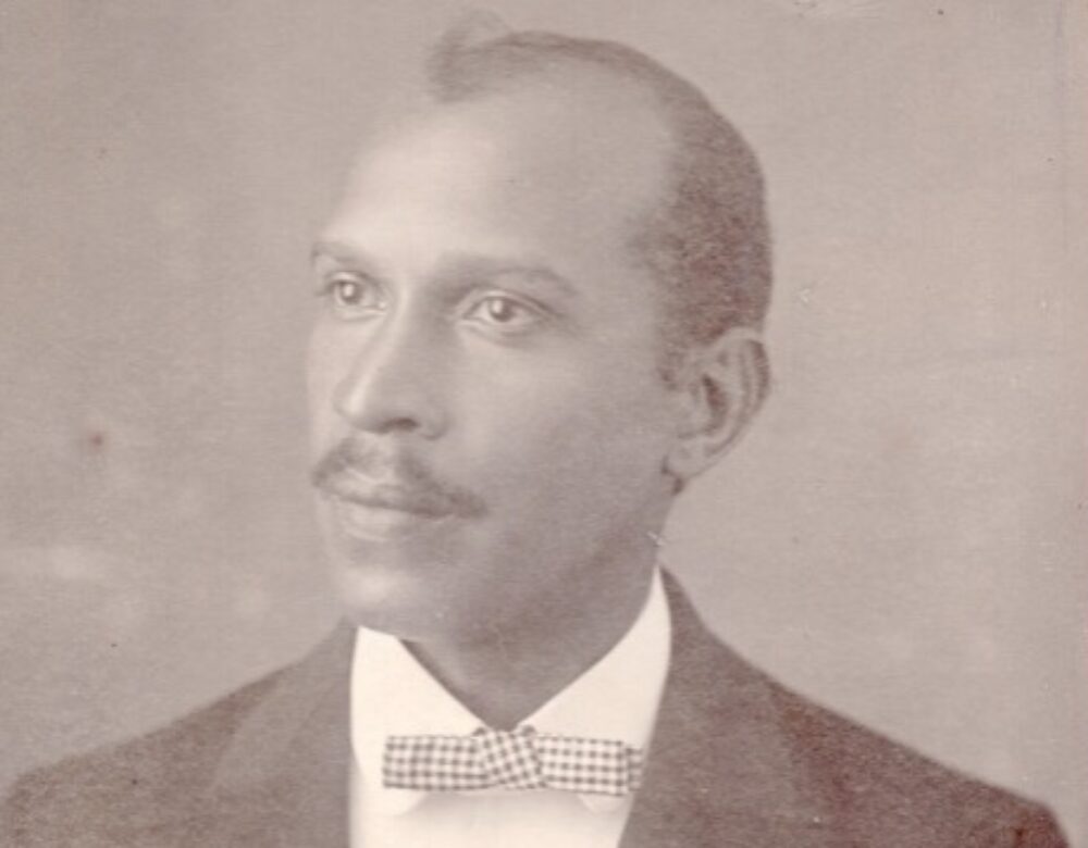 black and white portrait of a man wearing a bowtie