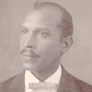 black and white portrait of a man wearing a bowtie