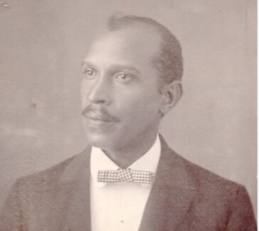 black and white portrait of a man wearing a bowtie