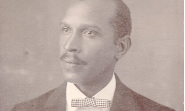 black and white portrait of a man wearing a bowtie