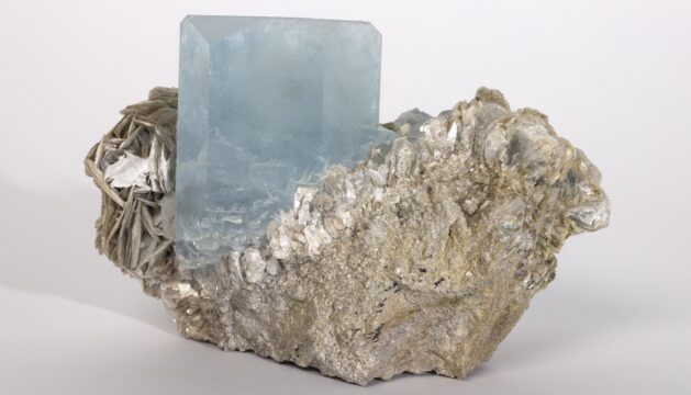 Aquamarine gemstone in muscovite
