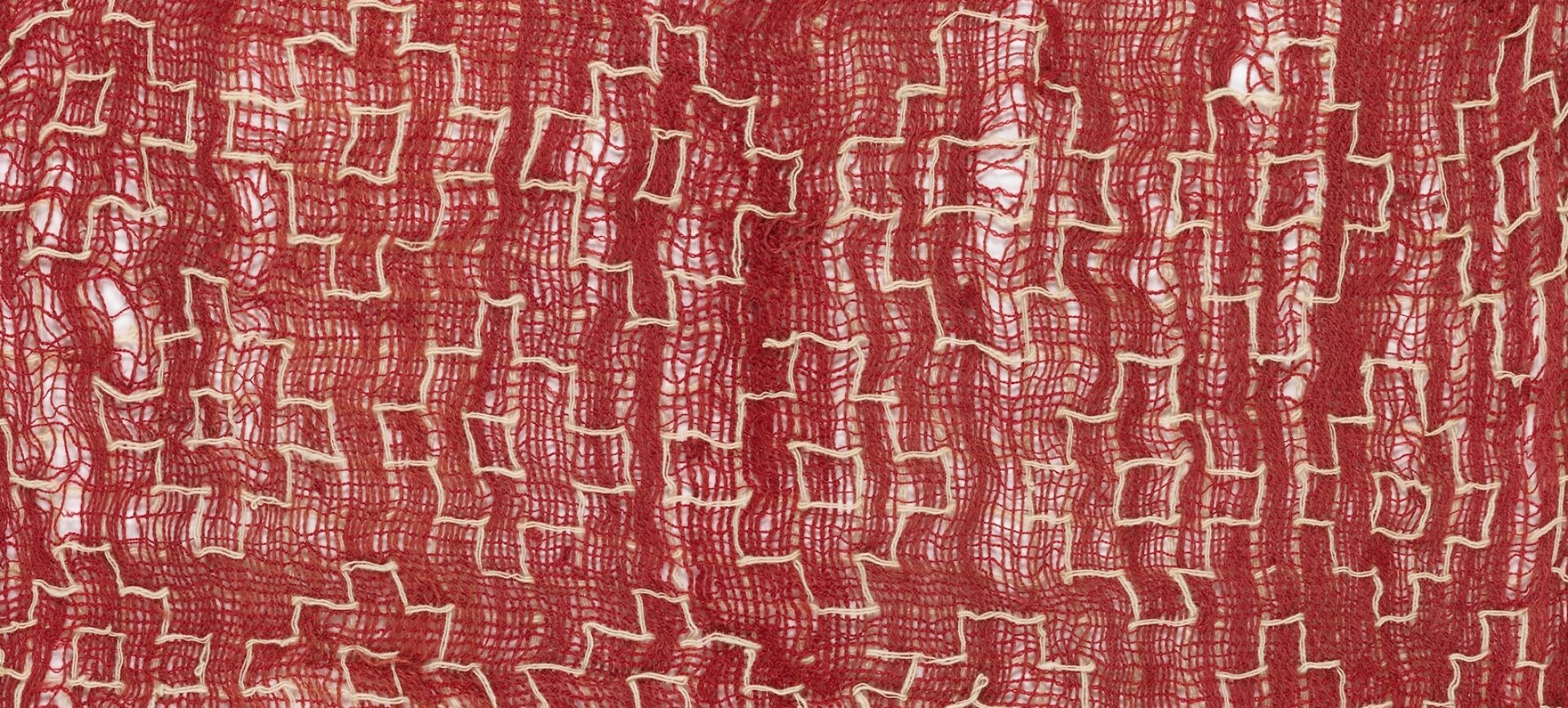 Photograph of a red cloth on a white background