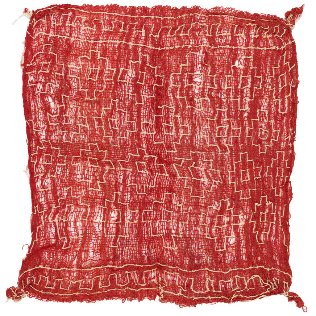 Photograph of a red cloth on a white background