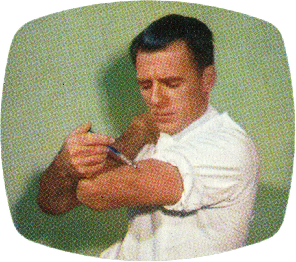 man with a syringe in his left arm