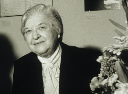 black and white photo of Stephanie Kwolek at a table