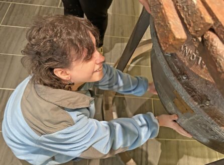 woman crouching to feel lower part of Bakelizer