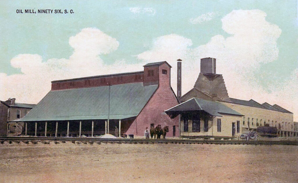 Postal coloreada de un edificio de fabricación agrícola