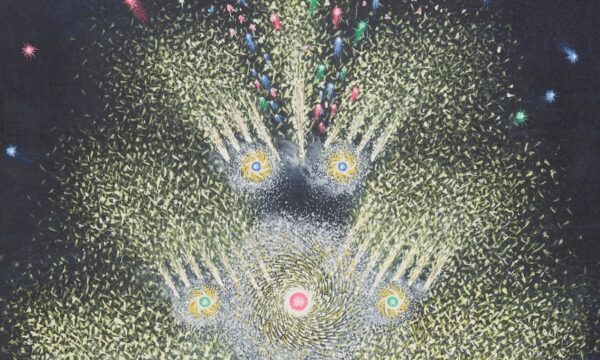 A colorful firework display with a person using a stick to ignite them, illustrating the history of fireworks.