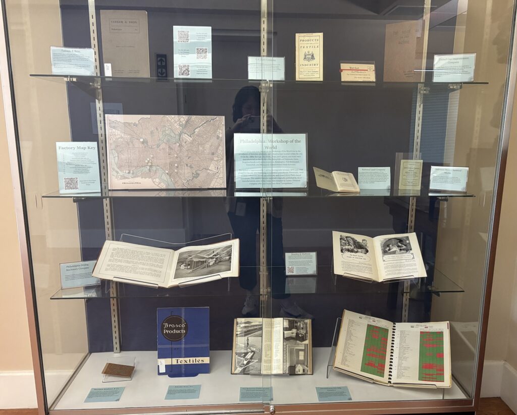 A display case full of Othmer Library books featuring Philadelphia companies.