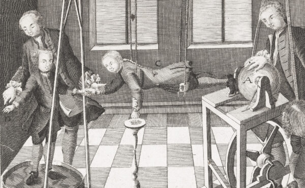 Illustration of a boy suspended by silk cords hanging from a ceiling while a man next him operates an electrostatic generator.