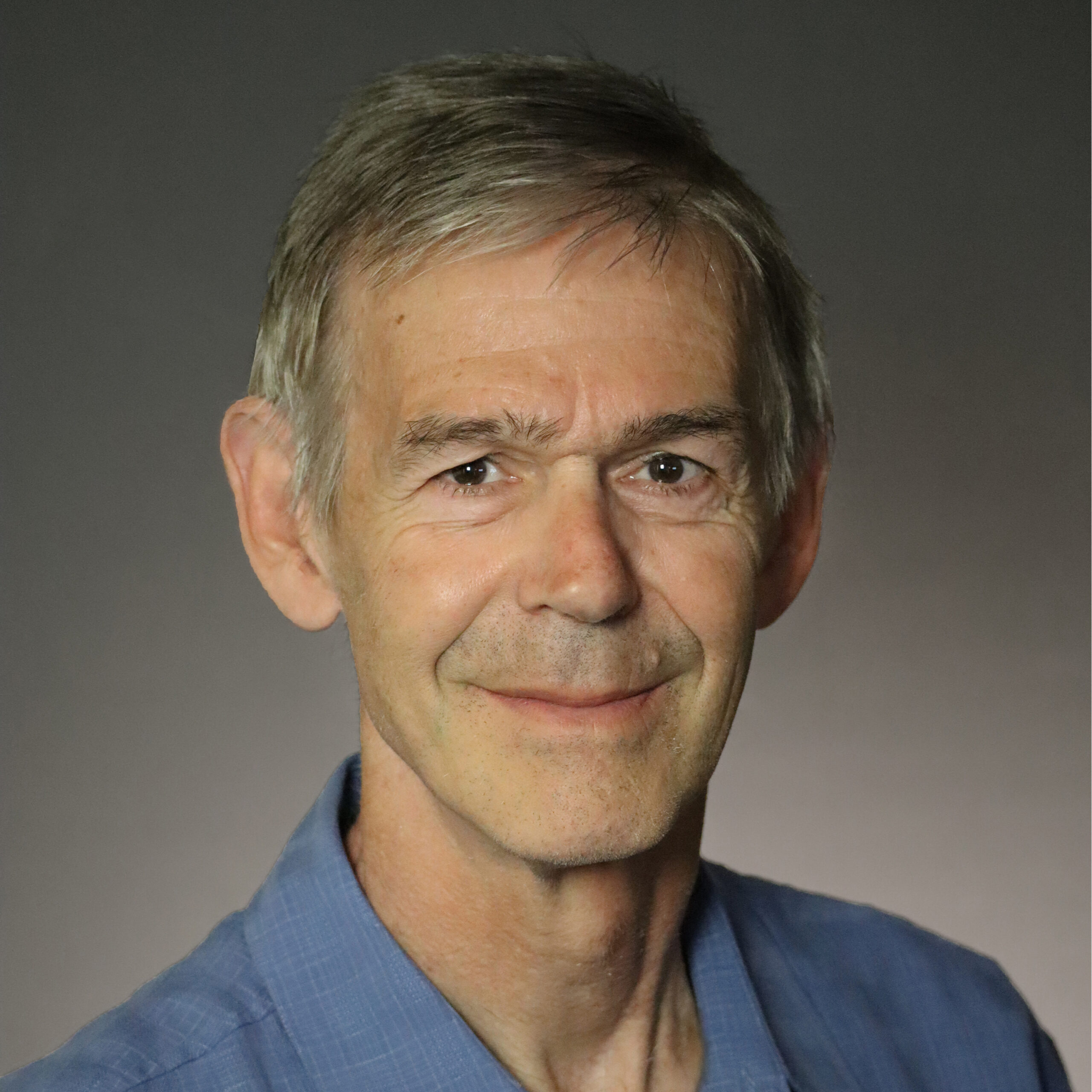Adriaan Bax studio portrait wearing blue shirt