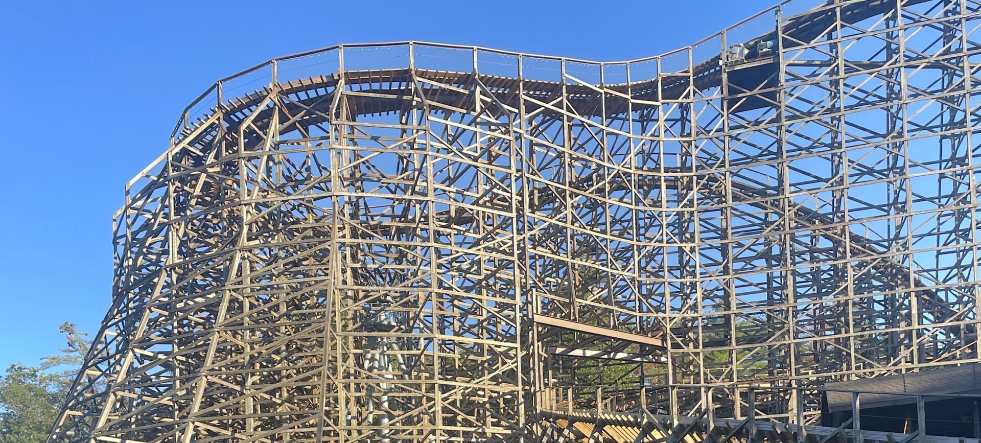 photo of a tall wooden roller coaster
