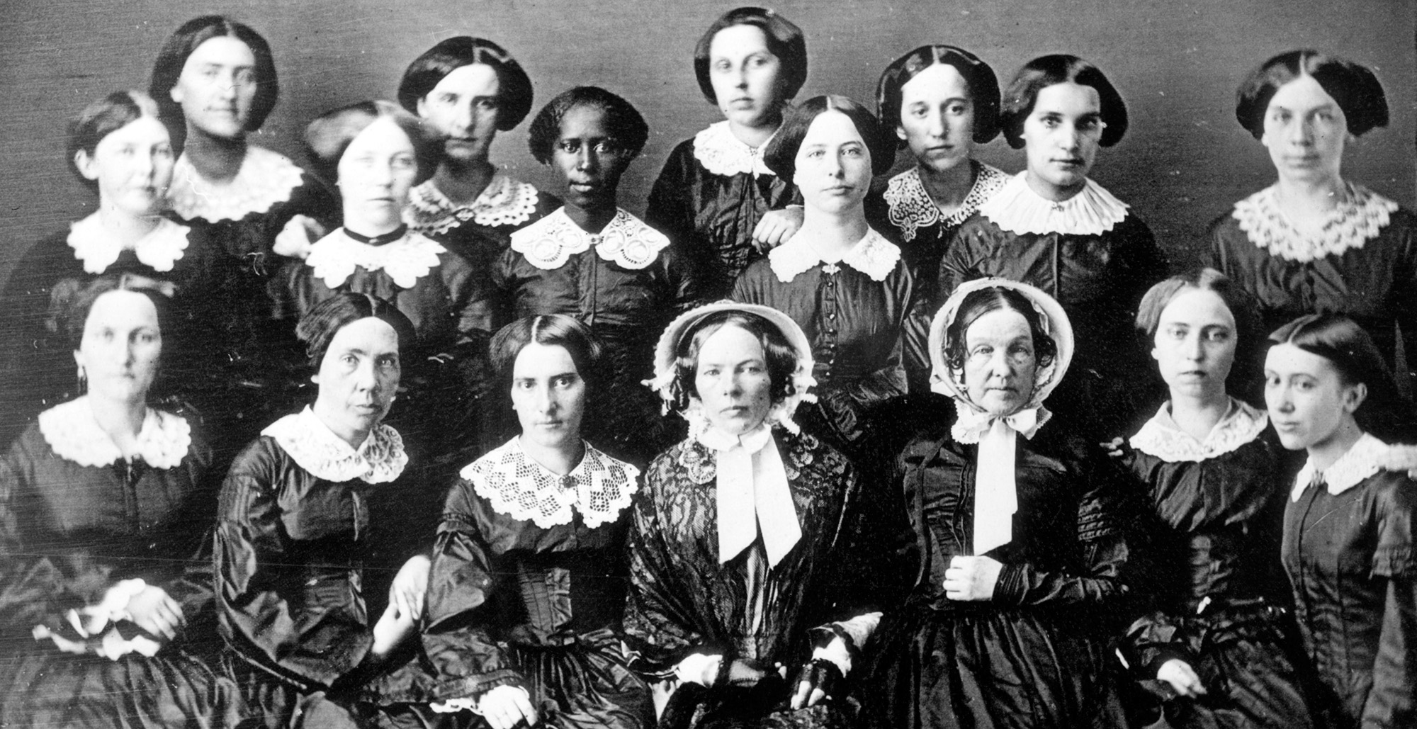 Daguerreotype of 17 women seated for a portrait.