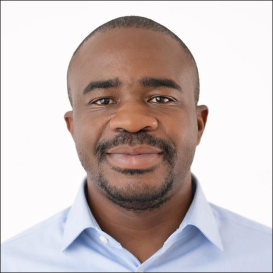 studio portrait of Aaron Albert Aryee in a light blue shirt