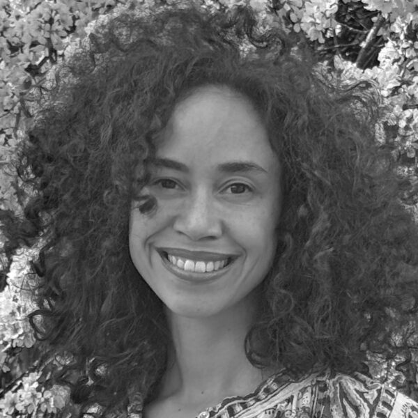 Black-and-white portrait of Alexis White, smiling