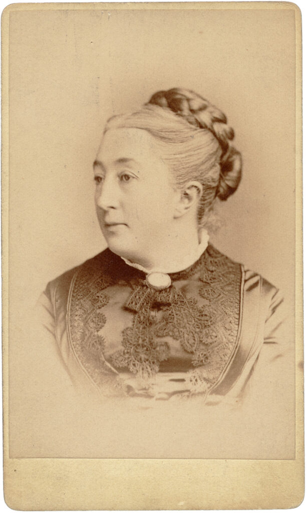 Photograph of a woman with her head slightly turned to the side