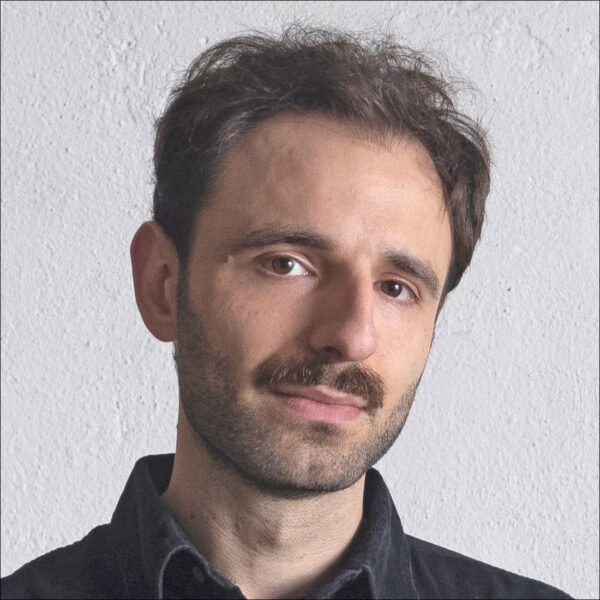 studio portrait of Julian Chehirian in dark shirt