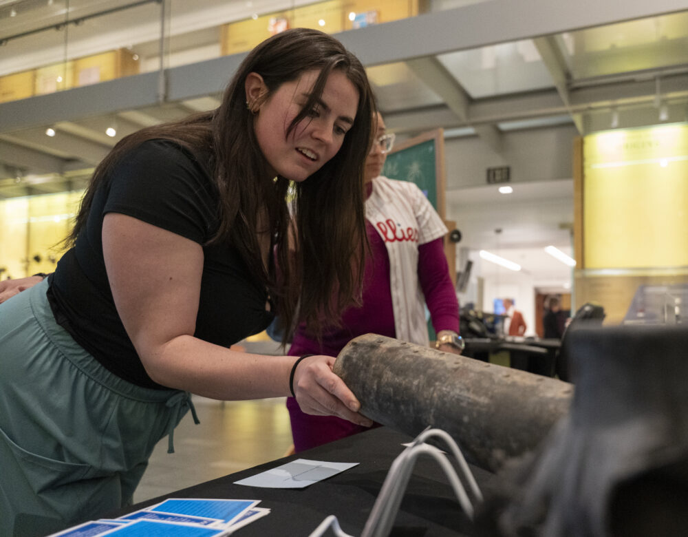 visitor touching an inert firework shell