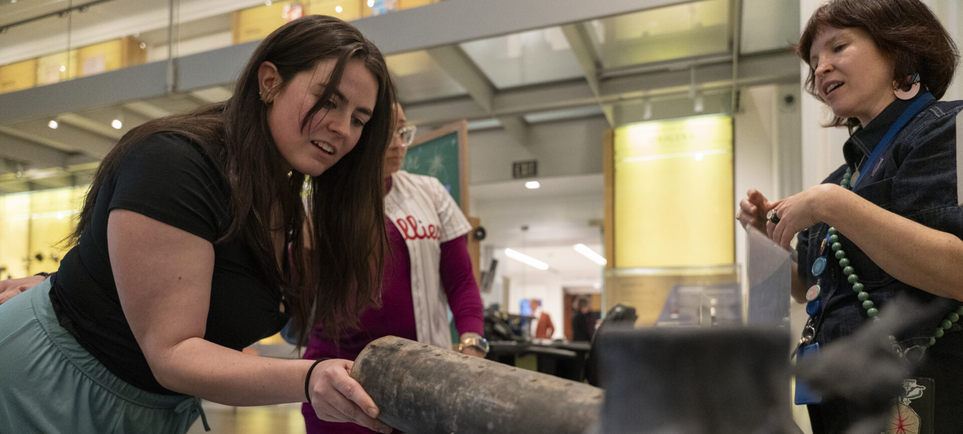 visitor touching an inert firework shell