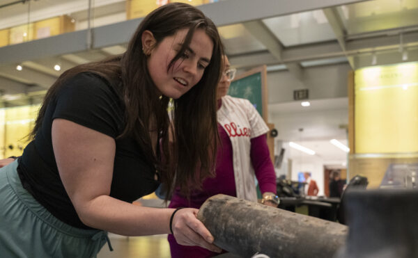visitor touching an inert firework shell