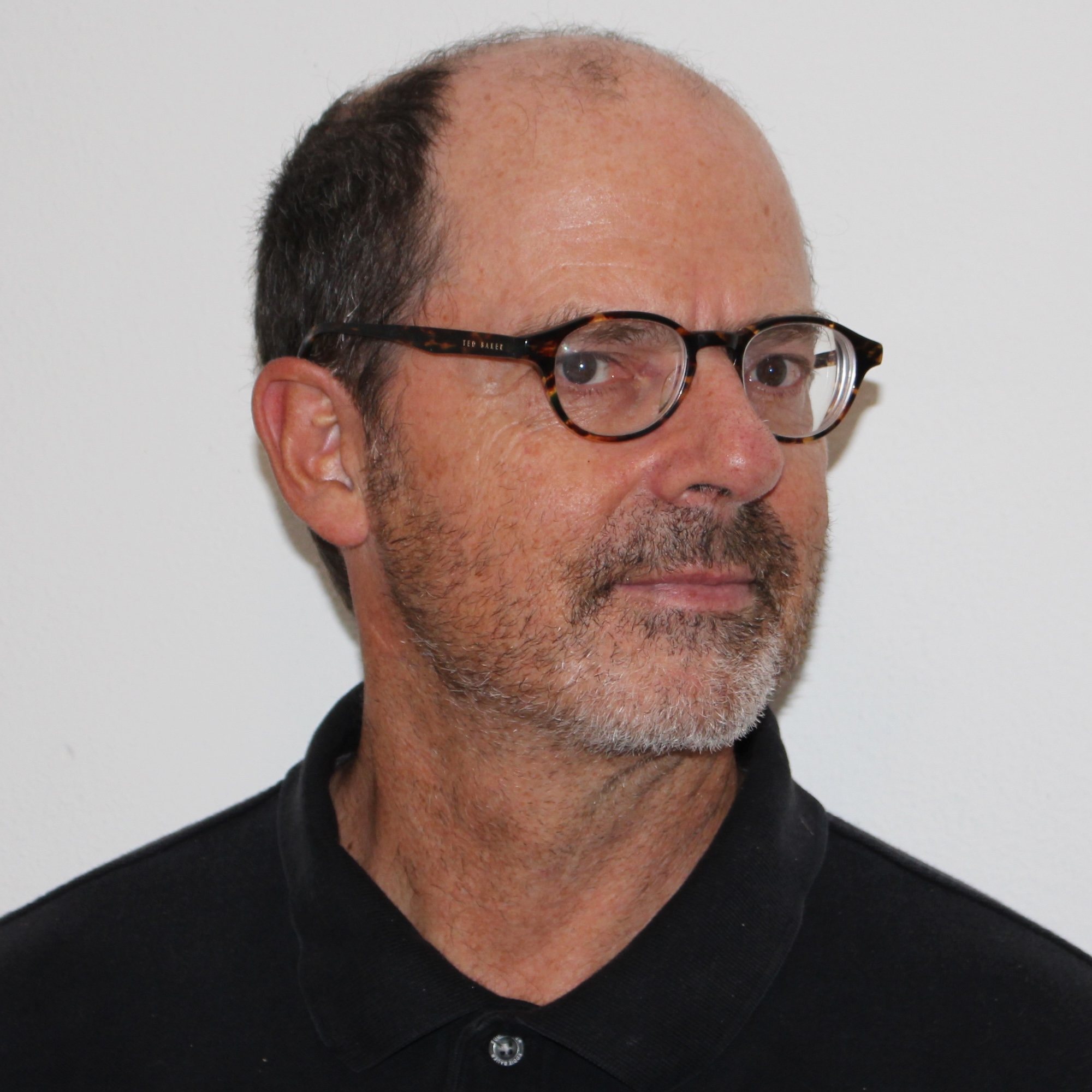 photo of a man with a goatee and glasses