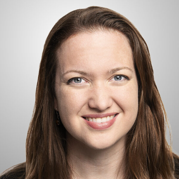 Charlotte smiling with brown hair worn down
