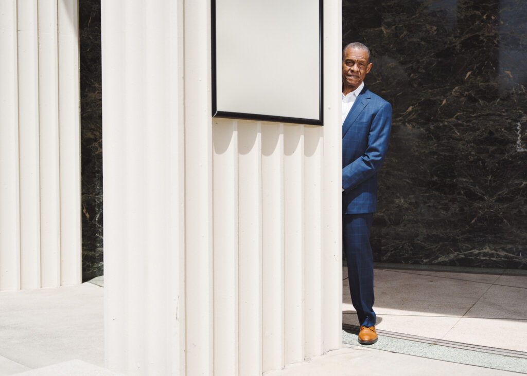 Portrait of a man half-concealed behind a column