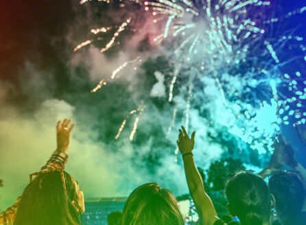 rainbow overlaid photo of people enjoying fireworks, "Celebrating ACS 150" logo in upper left corner