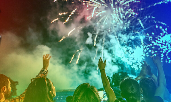rainbow overlaid photo of people enjoying fireworks, "Celebrating ACS 150" logo in upper left corner