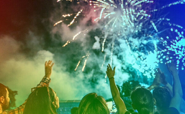 rainbow overlaid photo of people enjoying fireworks, "Celebrating ACS 150" logo in upper left corner