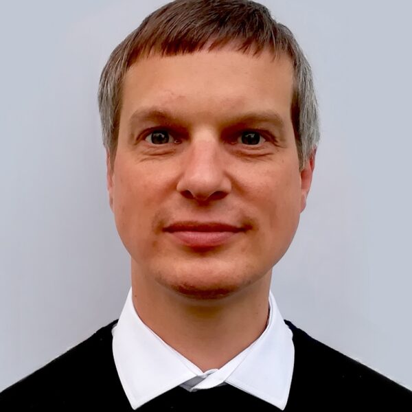 photo of a man wearing a white-collared shirt