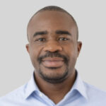 studio portrait of Aaron Albert Aryee in a light blue shirt