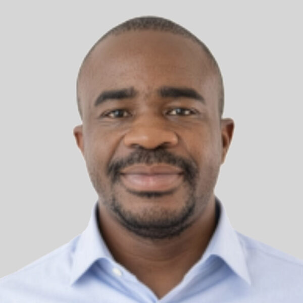 studio portrait of Aaron Albert Aryee in a light blue shirt