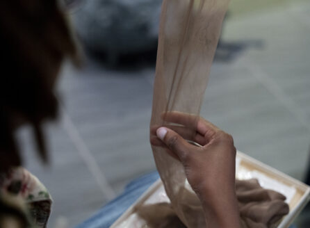 right hand touching a nylon stocking