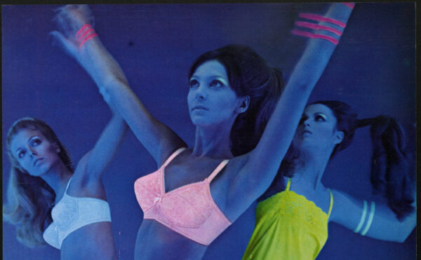 ad depicting dancers in neon undergarments under black light