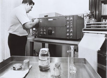black and white photo of a man using a chromatagraph