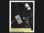 black and white photo of lit cigarette next to microchip