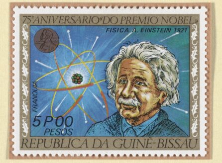 postage stamp depicting a drawing of Albert Einstein, along with a Nobel Prize medal and an atom.