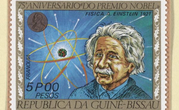 postage stamp depicting a drawing of Albert Einstein, along with a Nobel Prize medal and an atom.