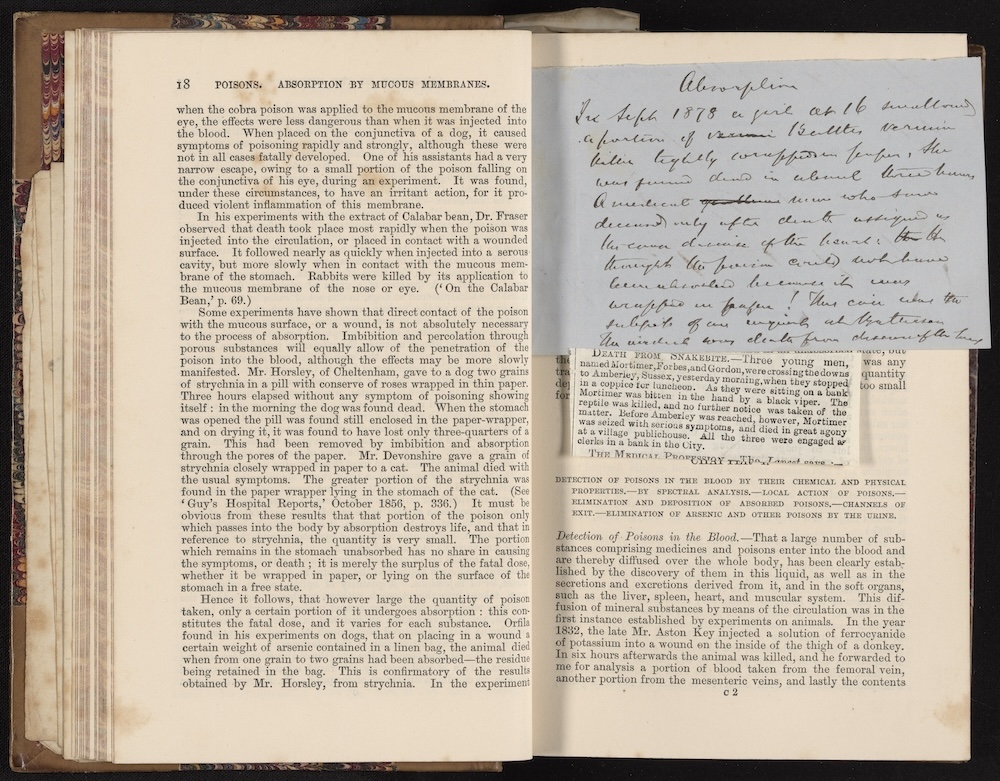 open book with handwritten note on top of pages