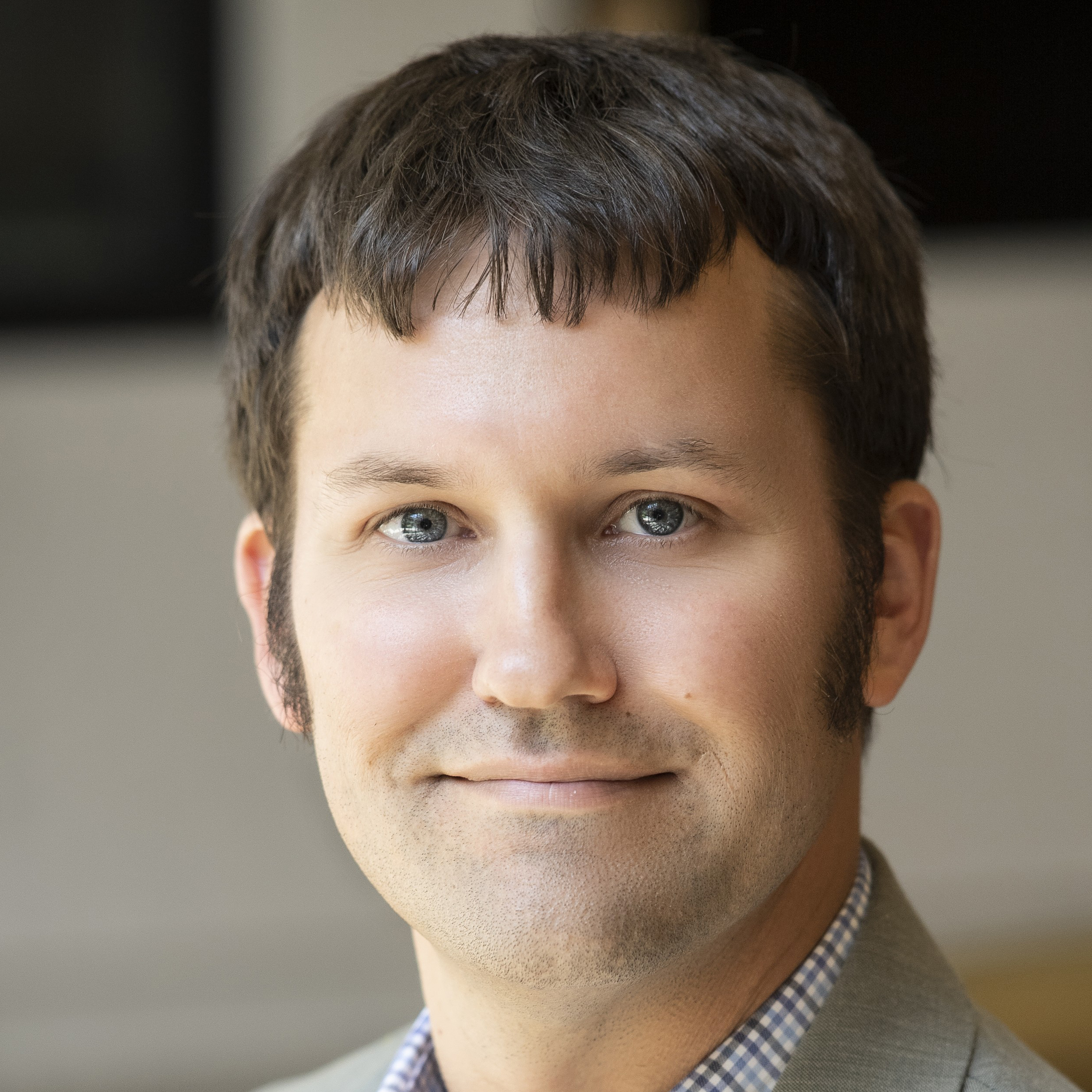 portrait of Dave Walter in tan jacket
