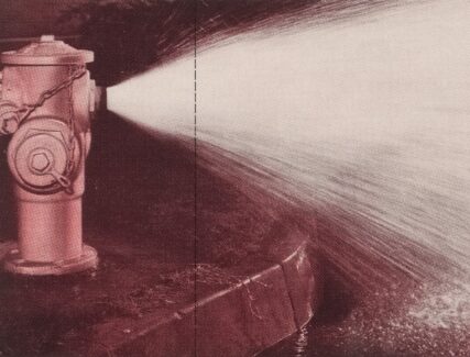 red fire hydrant shooting out water