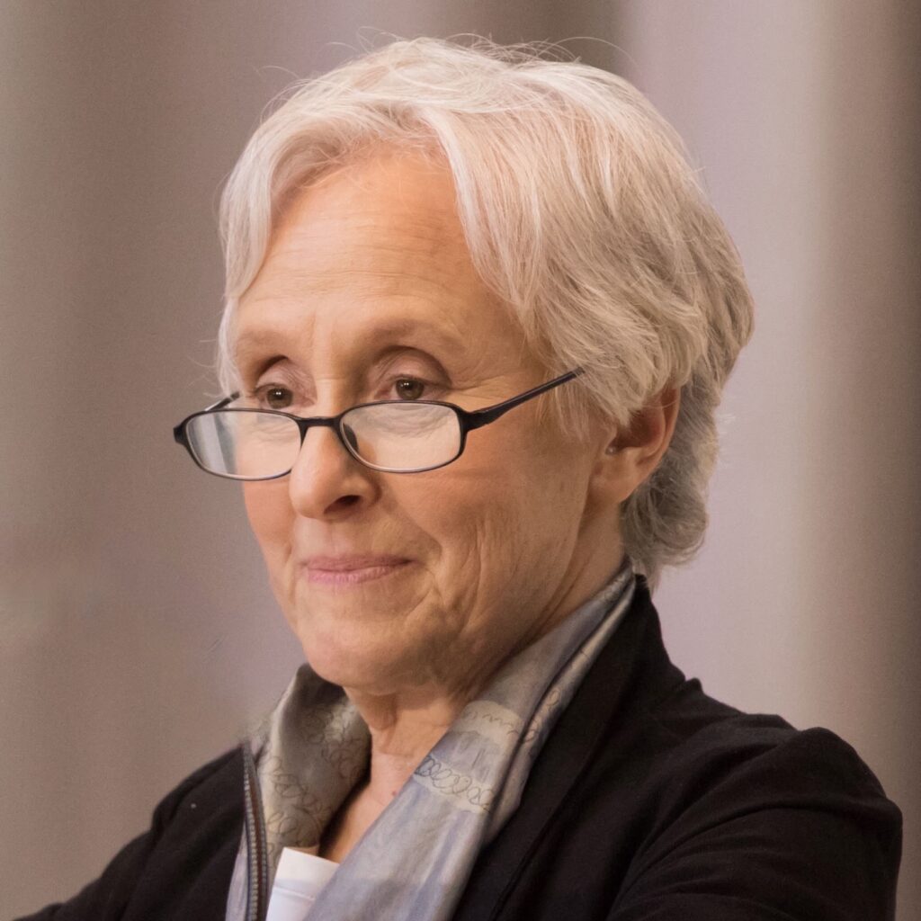photo of a woman with white hair wearing glasses