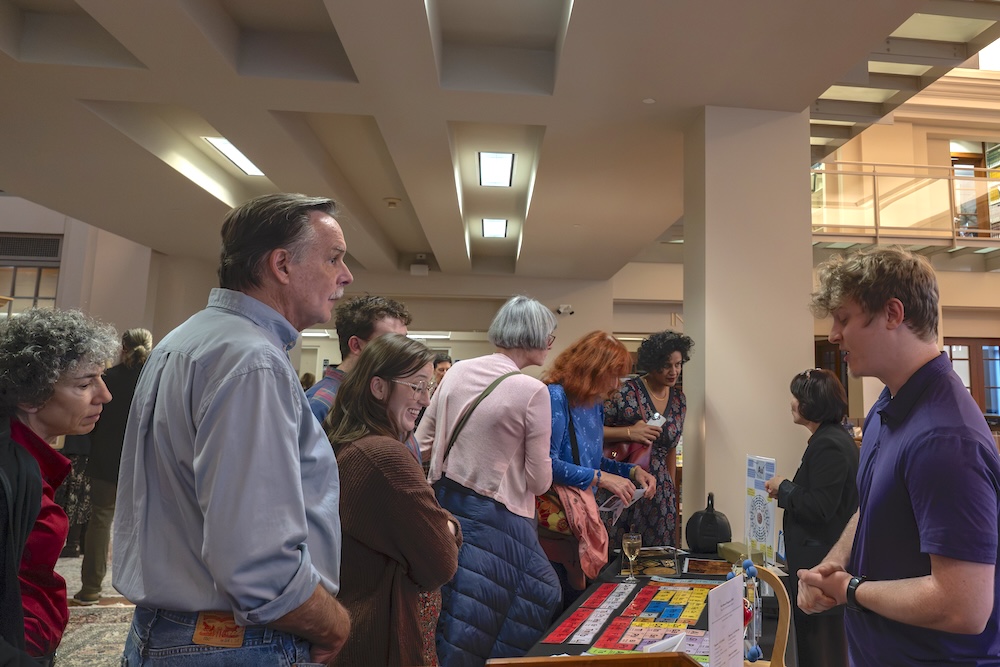 Attendees take an up-close look at paintings and rare books from the Institute's 'Fire and Gold' exhibit while enjoying a curator’s talk, activities, and light bites.
