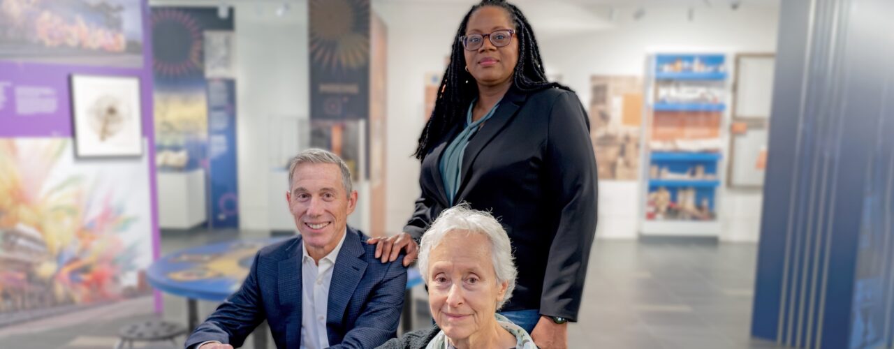 photo of 3 people in a museum