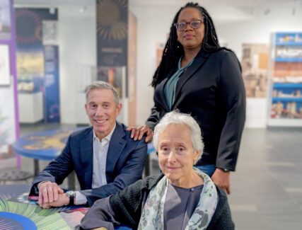 photo of 3 people in a museum