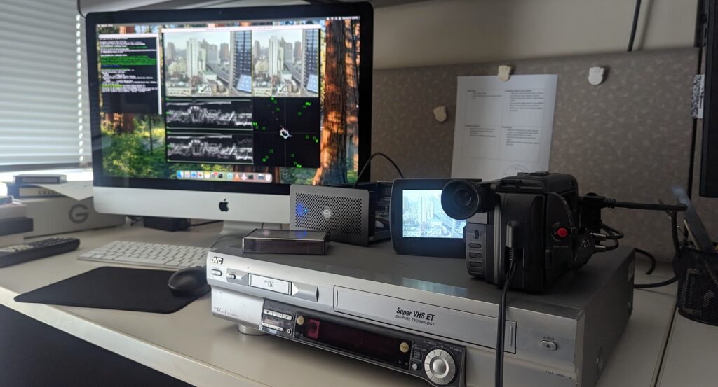 A Hi8 tape playing in the camcorder and being captured on the computer.