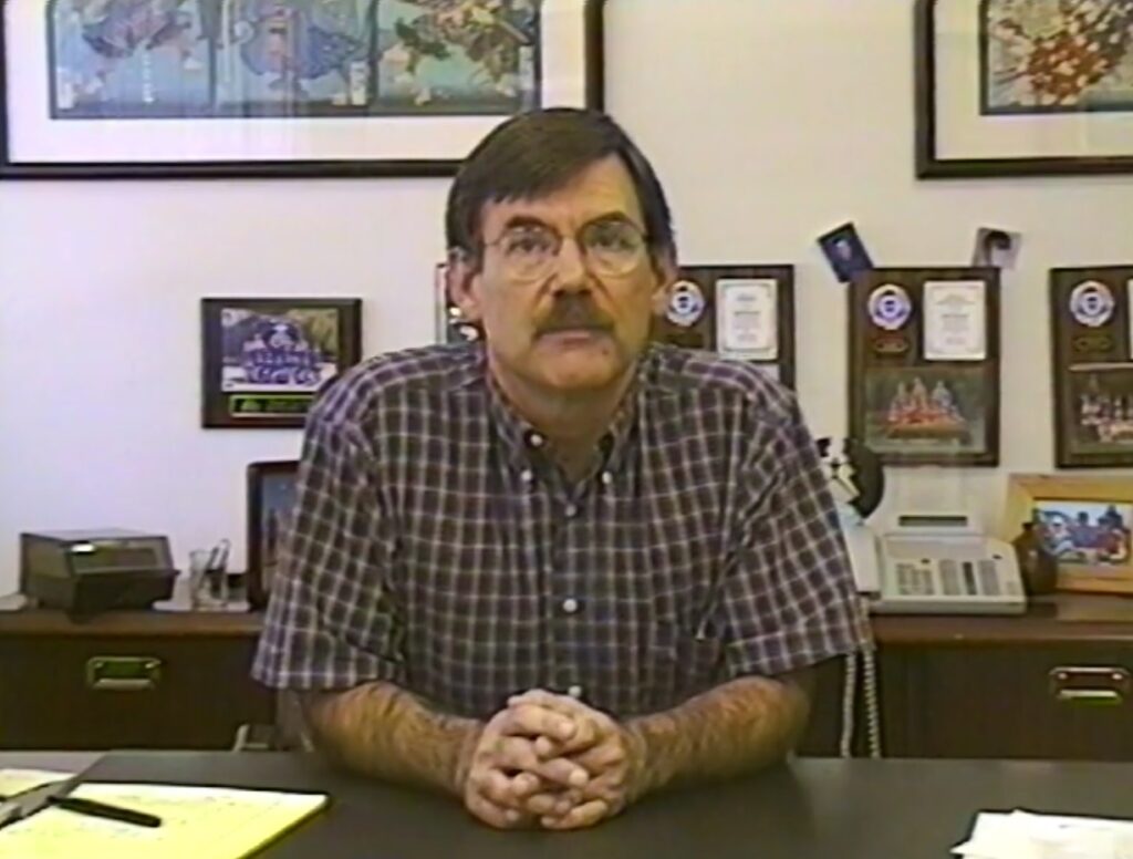 man sitting at a desk